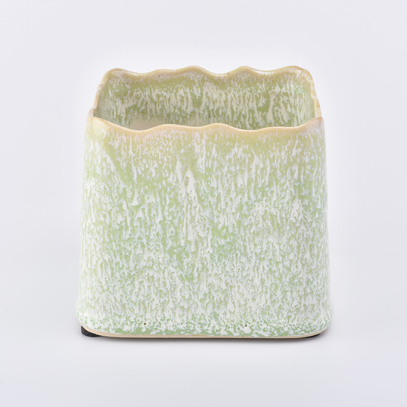 hellgrünes quadratisches Keramikkerzenglas