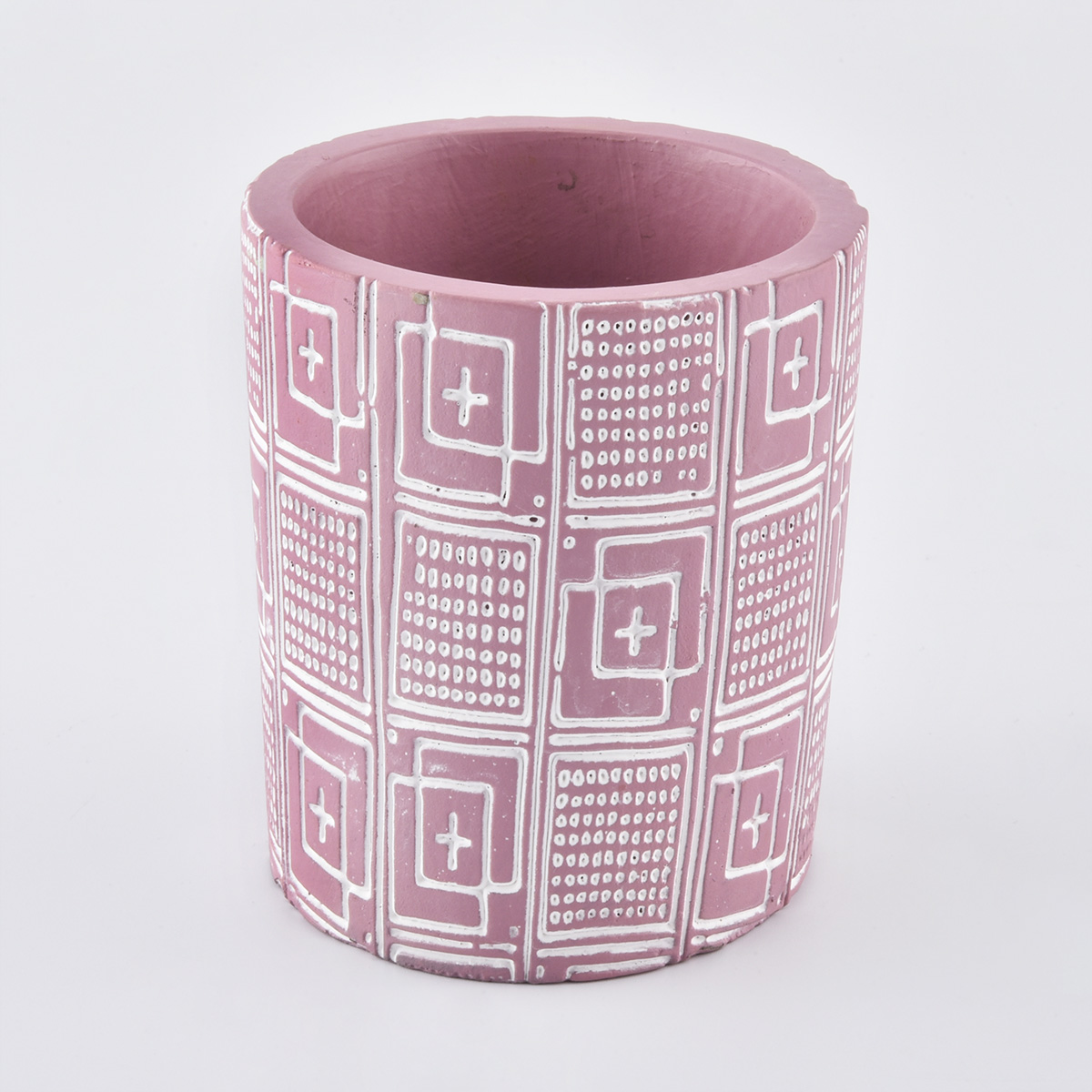 pot de bougie rose avec motif en relief blanc