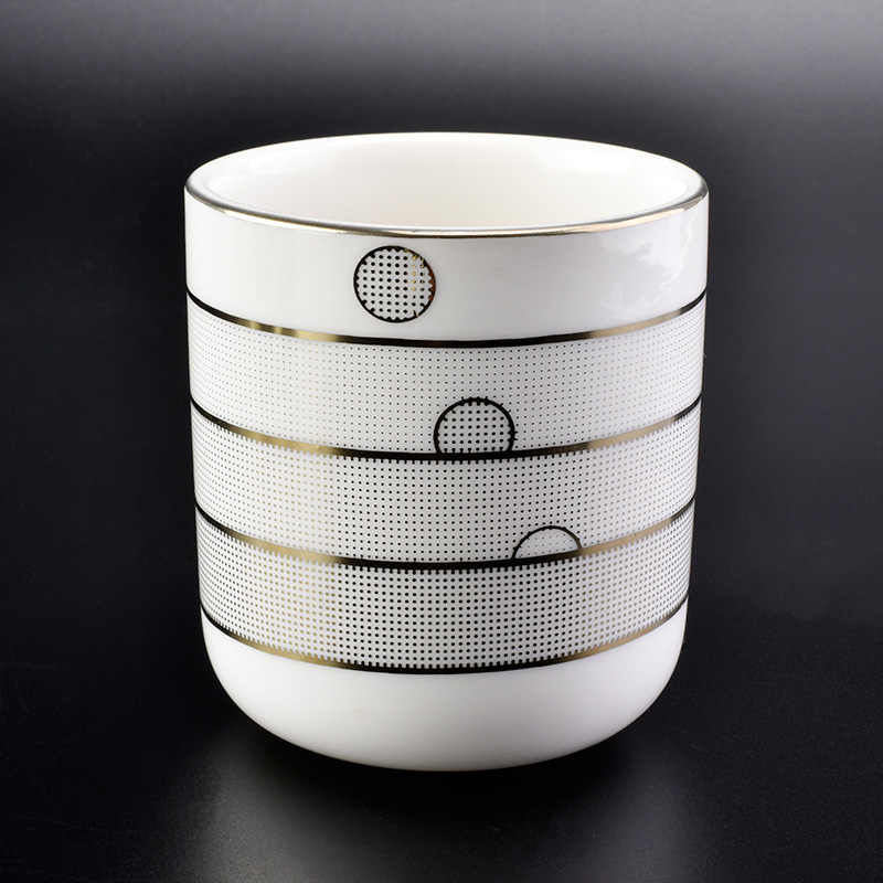 round ceramic candle vessels in white with gold rim