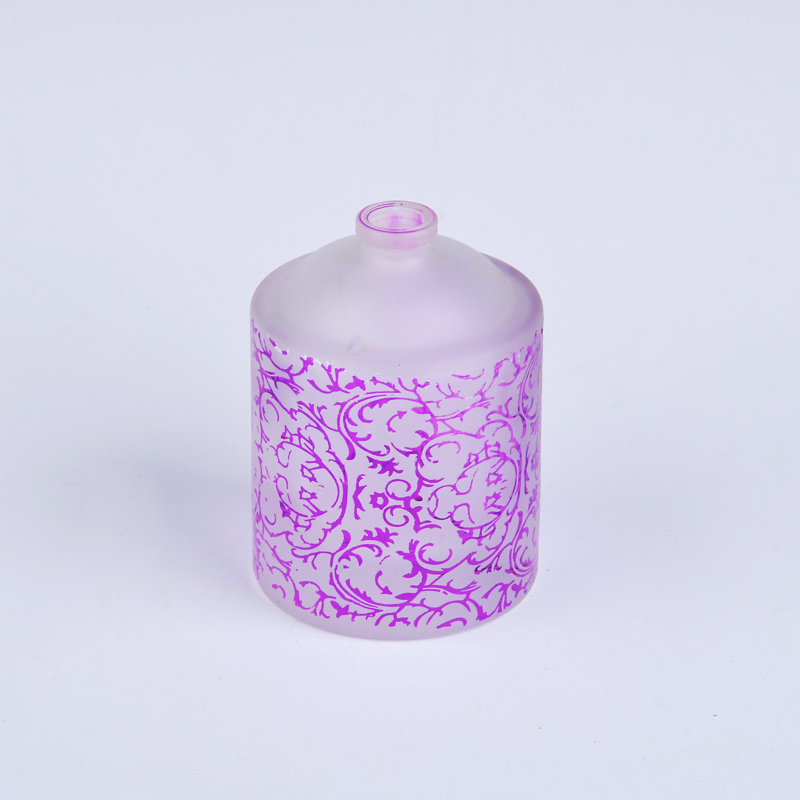 botella de perfume de cristal redonda con pulverización