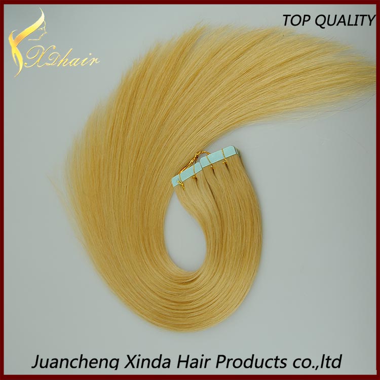 La alta calidad del pelo 8 "-30" al por mayor 100% de las extensiones de cabello de cinta del pelo indio de la alta calidad y rizado