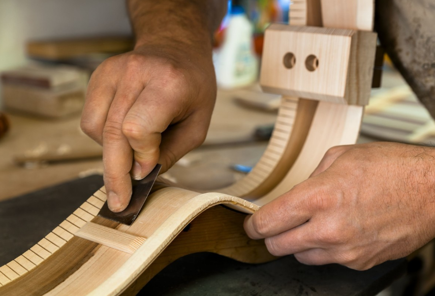 China Folk acoustic guitar production process fabricante